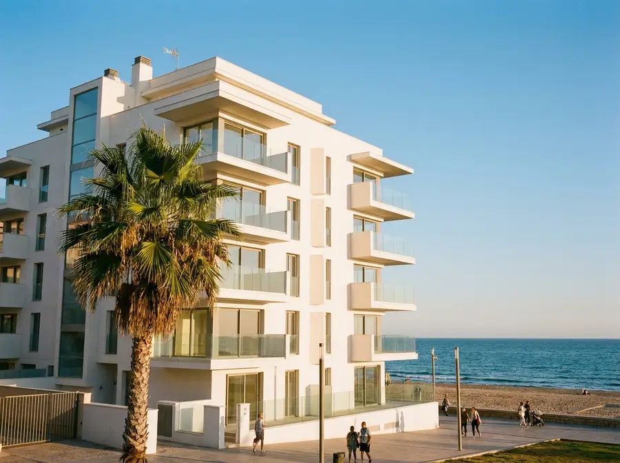 A new white mid-rise building with balconies